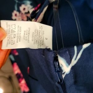 Macy's new dress never worn Navy Blue with flowers. Beautiful style design.